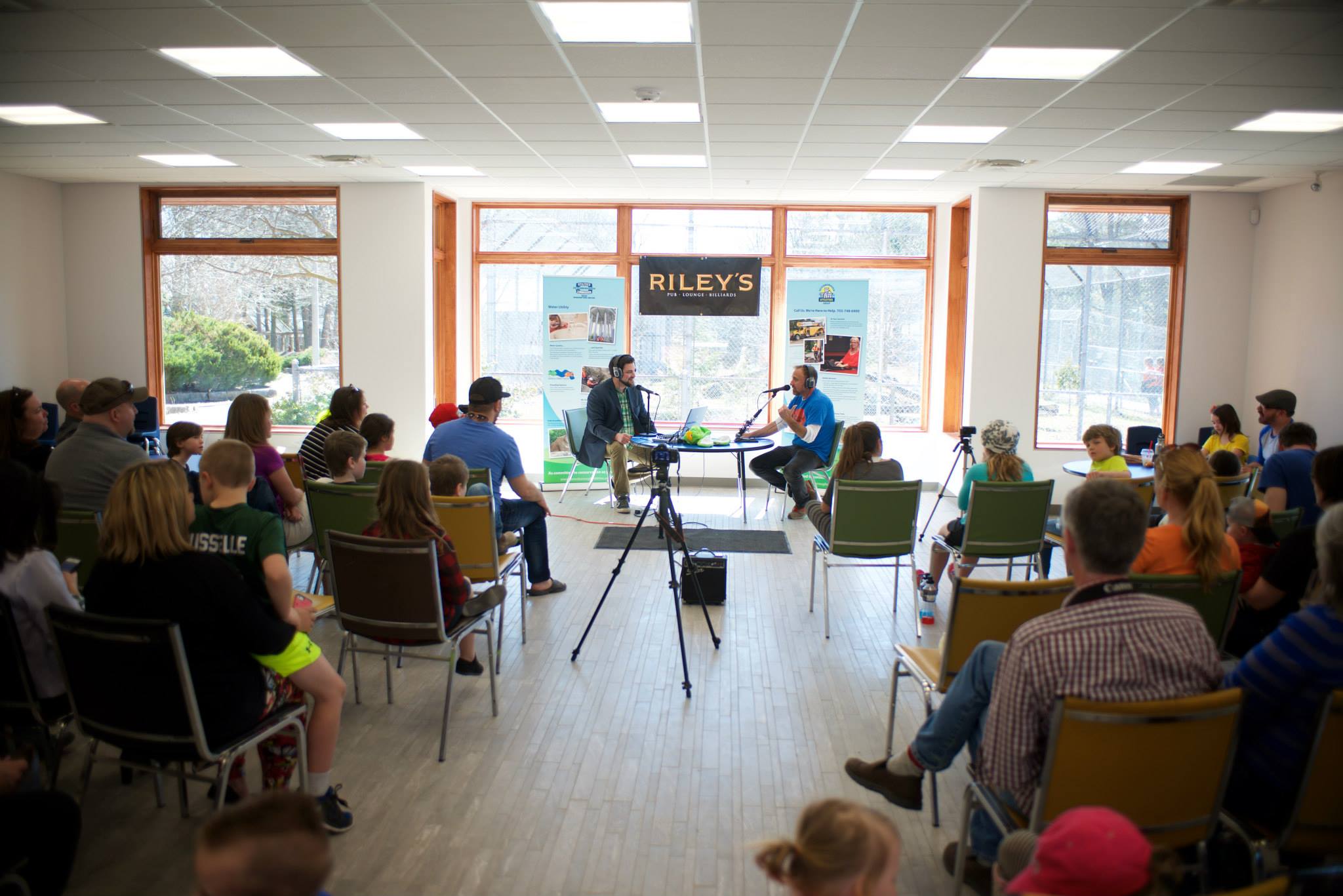 guest speaker being interviewed in front of a group of people sitting in chairs