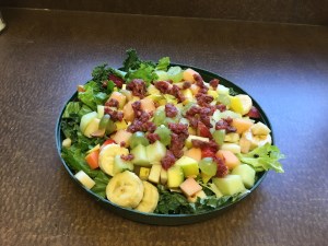 bowl full of fruits and lettuce